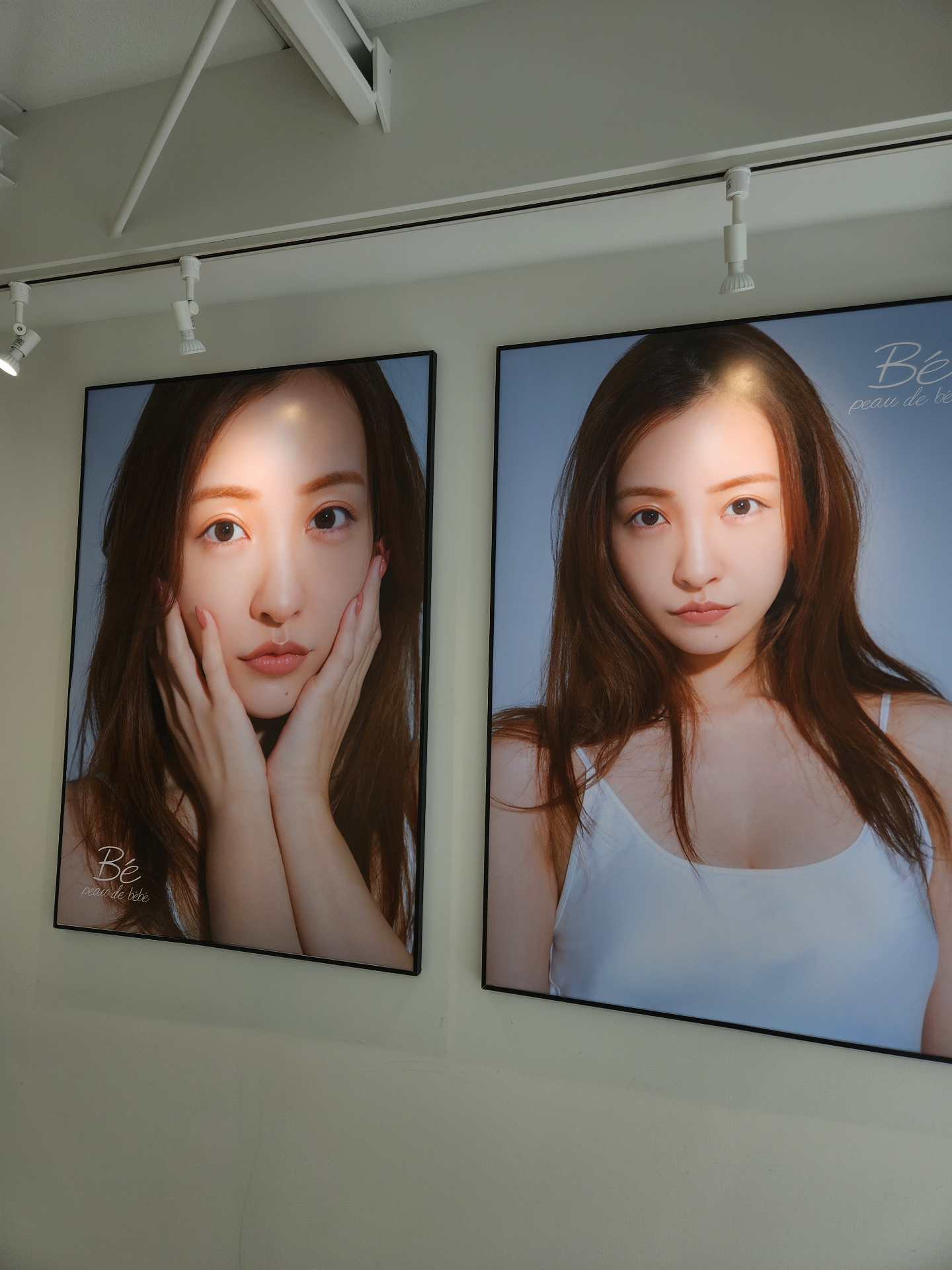 Visuals for the Be peau de bebe skincare brand on display in the showroom.