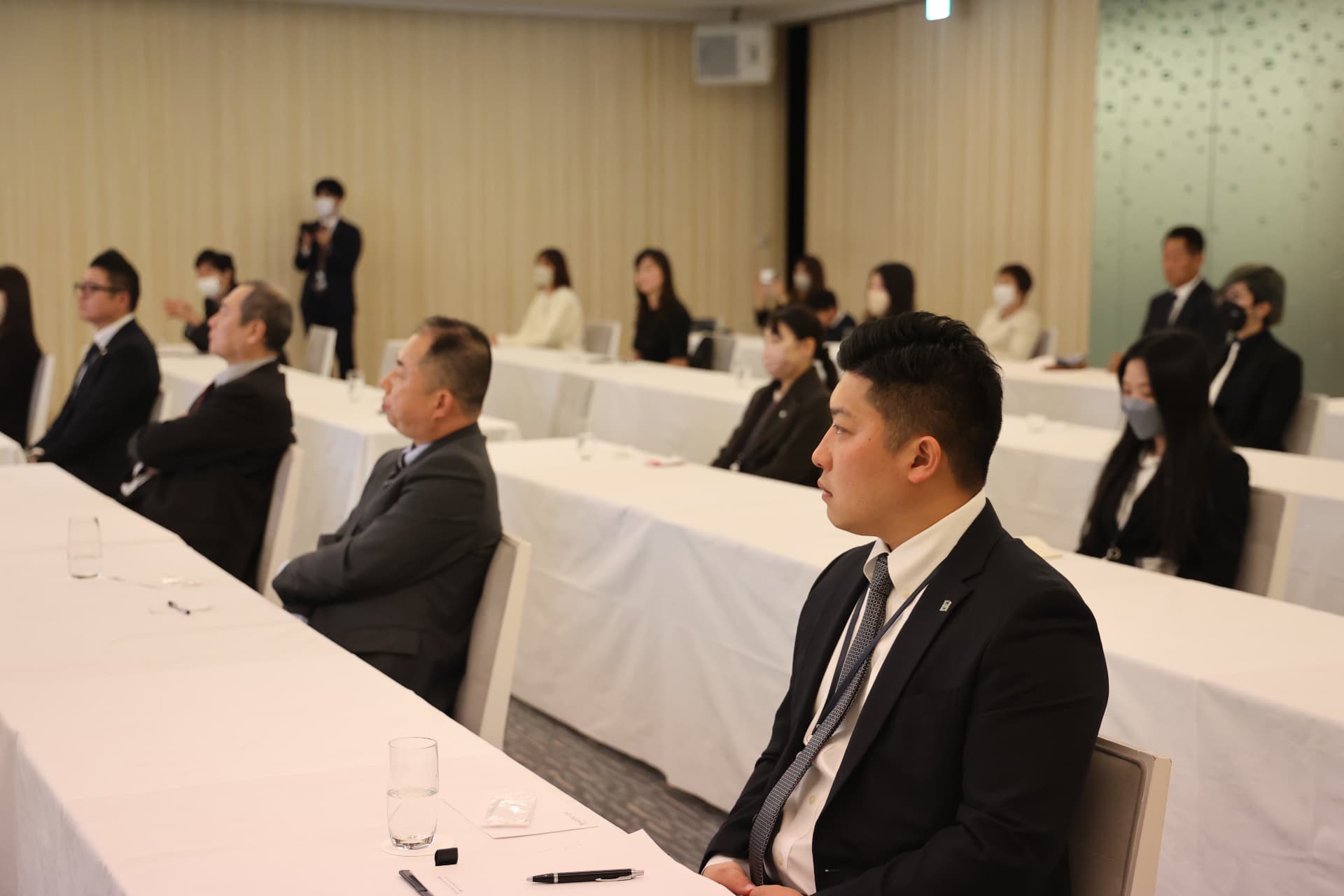 Employees and partners attending the policy briefing.