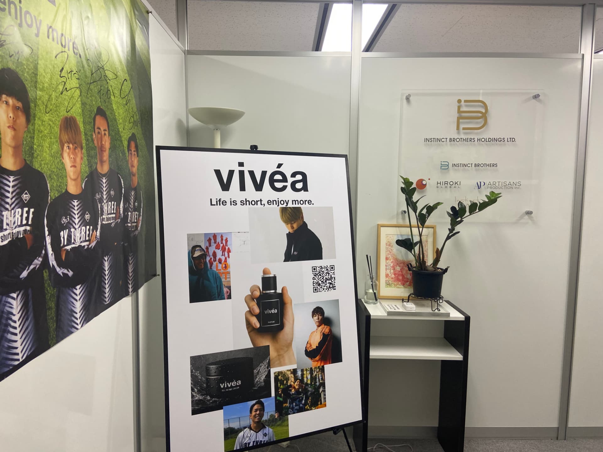 The vivéa brand board beside the group company signage at the Tokyo office.