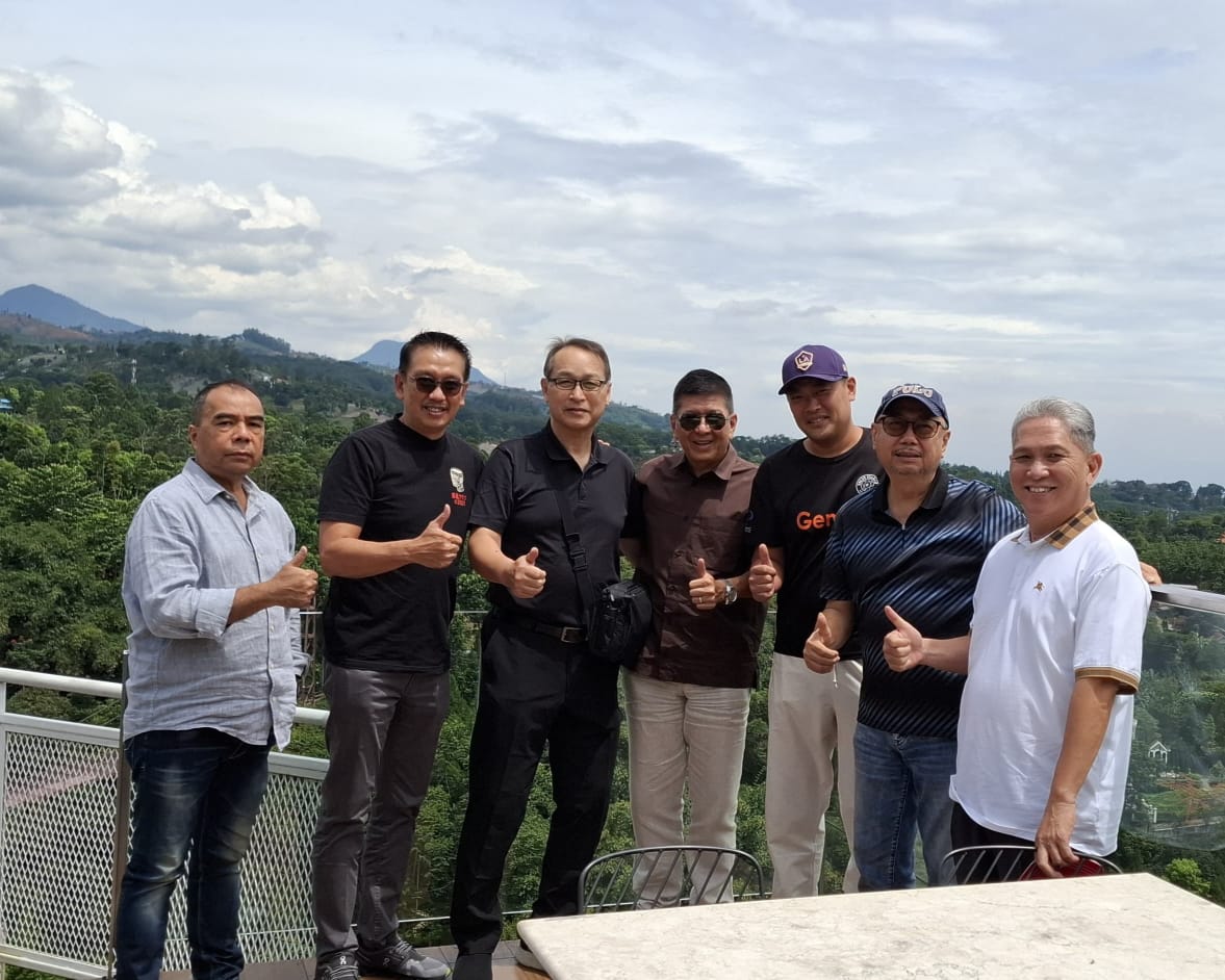 Site visit with Indonesian partners in the highlands outside Jakarta, reviewing a prospective development location.
