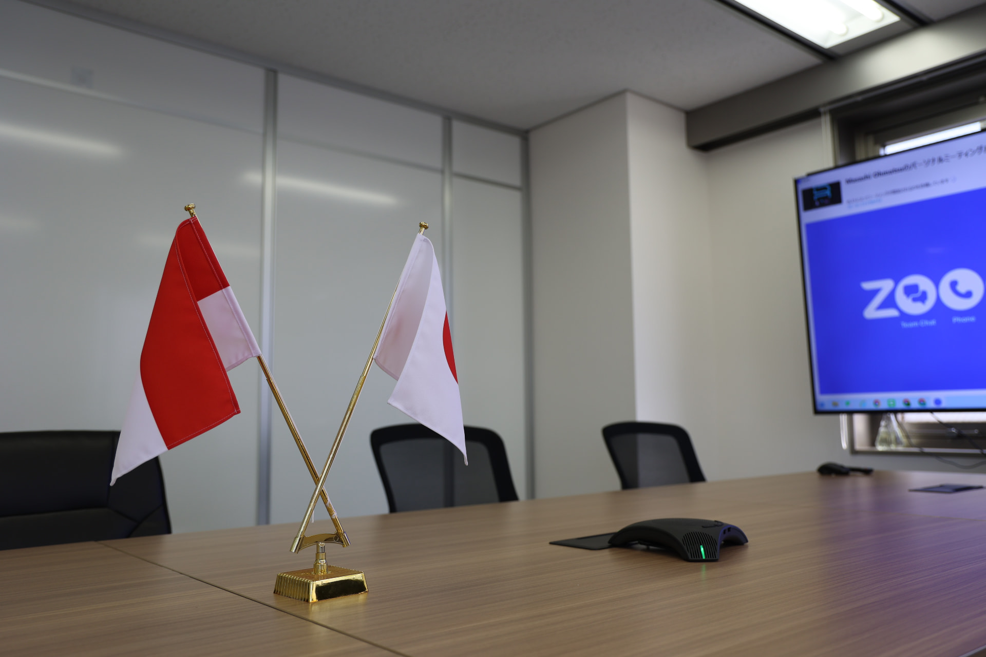 Indonesian and Japanese flags in the meeting room before a partnership session.
