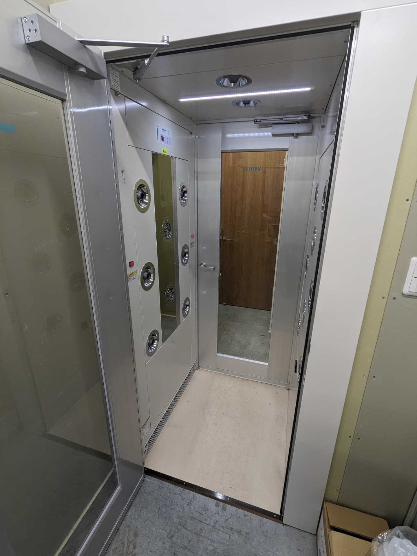 Air shower at the entrance to the compounding room, maintaining cleanroom control.