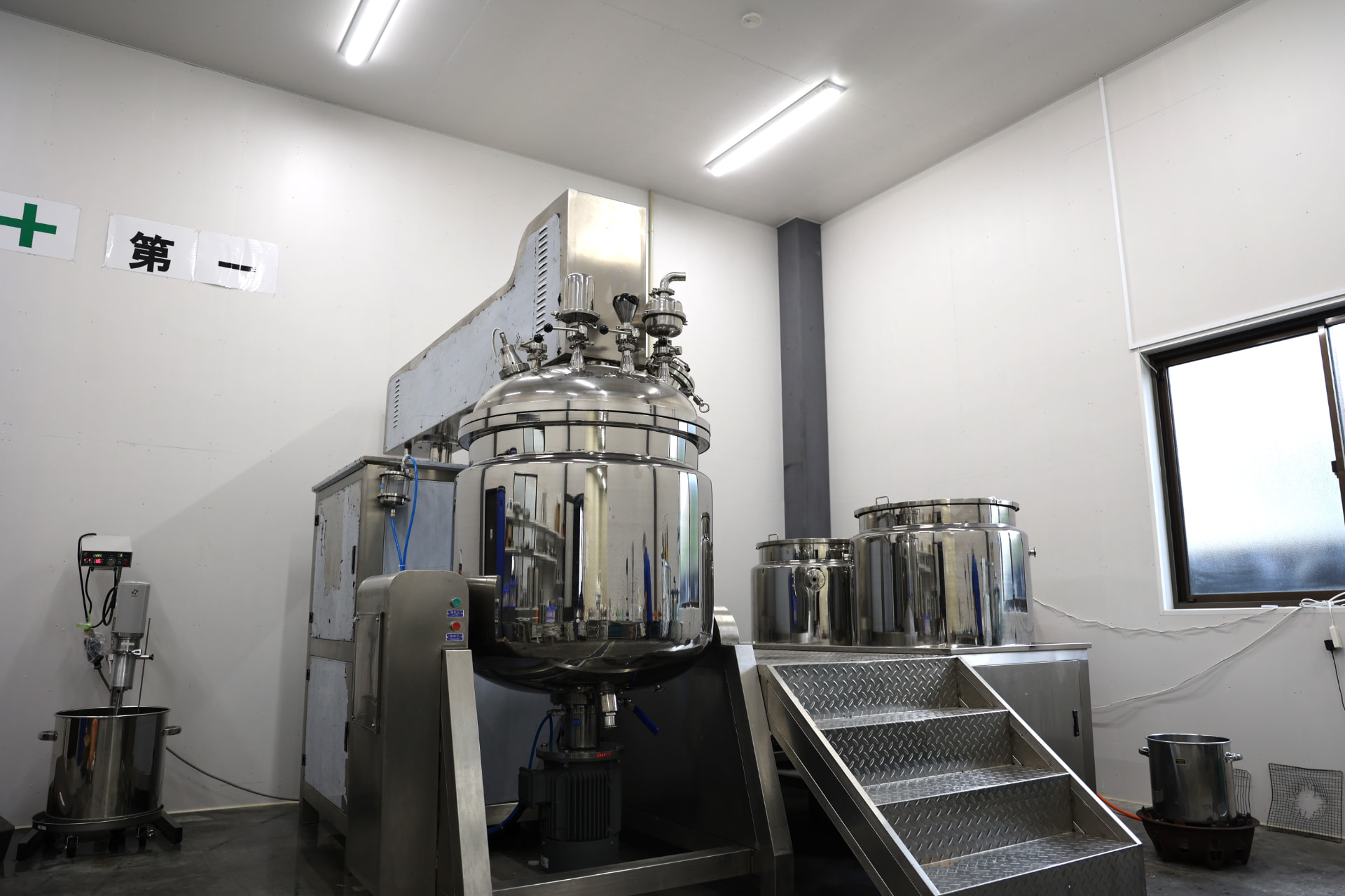 Vacuum emulsifying vessel in the compounding room of the group's cosmetics plant.